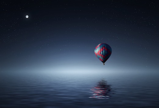 air balloon over a dark sea